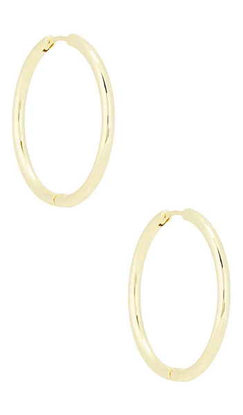  Shashi Essential Hoop Earrings In Metallic Gold. 